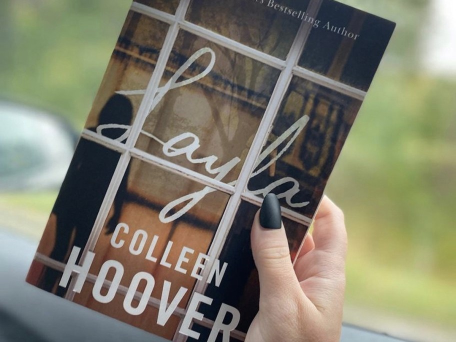 hand holding colleen hoover layla book 