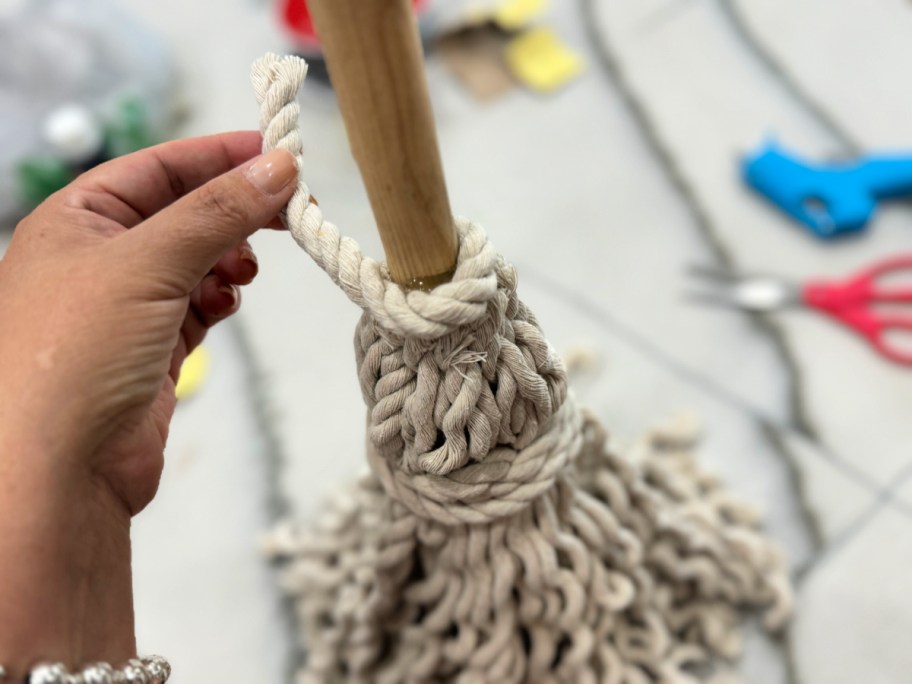 covering hot glue with rope piece