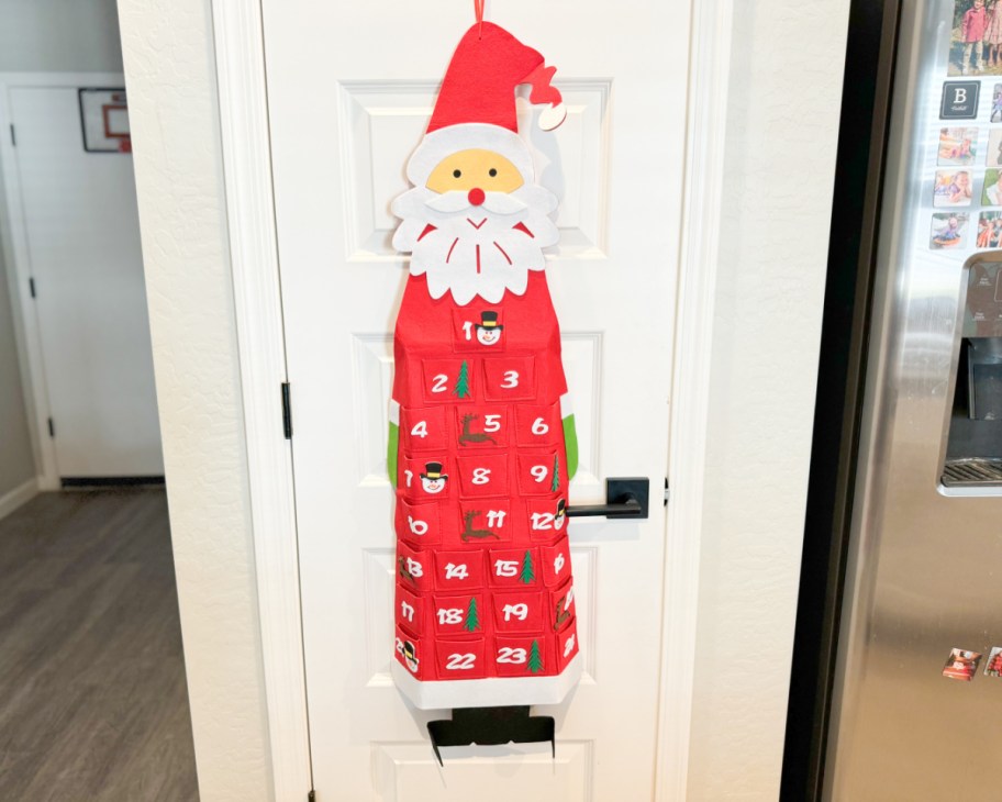 felt santa advent calendar hanging on door