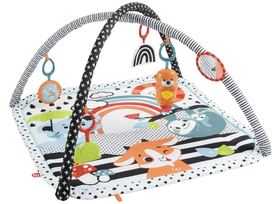 black and white fisher price playmat with toys 