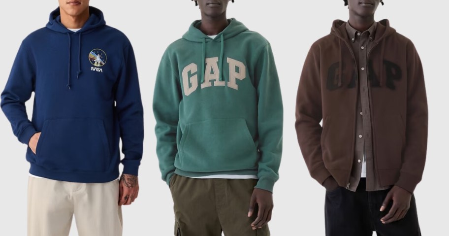 man wearing a blue Nasa logo hoodie, man wearing a green GAP logo hoodie, and man wearing a brown GAP zup up hoodie