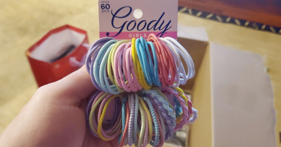 hand holding kids goody hairties pack