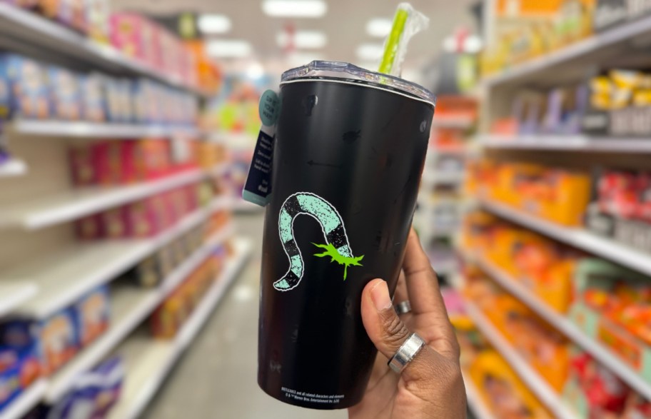 hand holding beetlejuice mug in the store