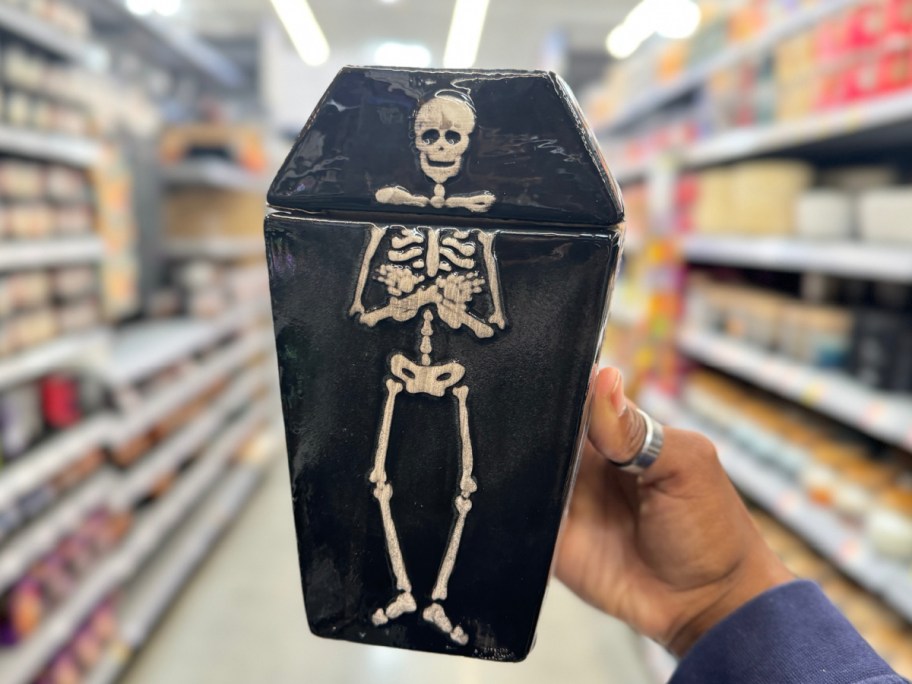 hand holding skeleton jar at Walmart