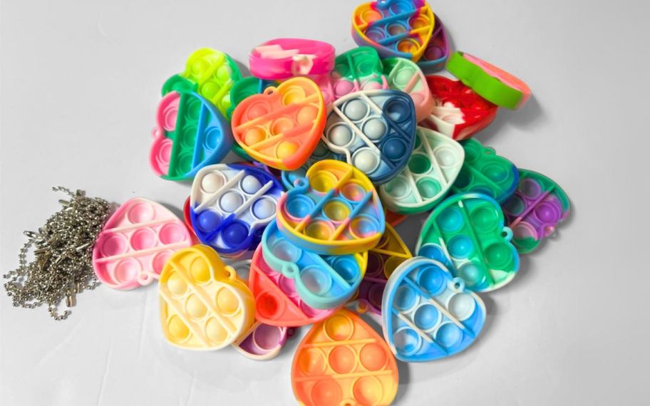 heart shaped fidget toy keychains in a pile.