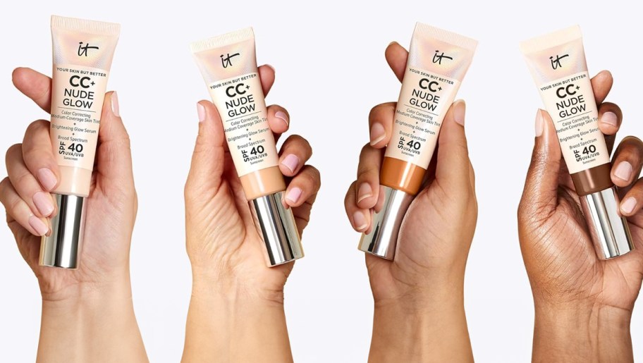 four hands holding it cosmetics foundation