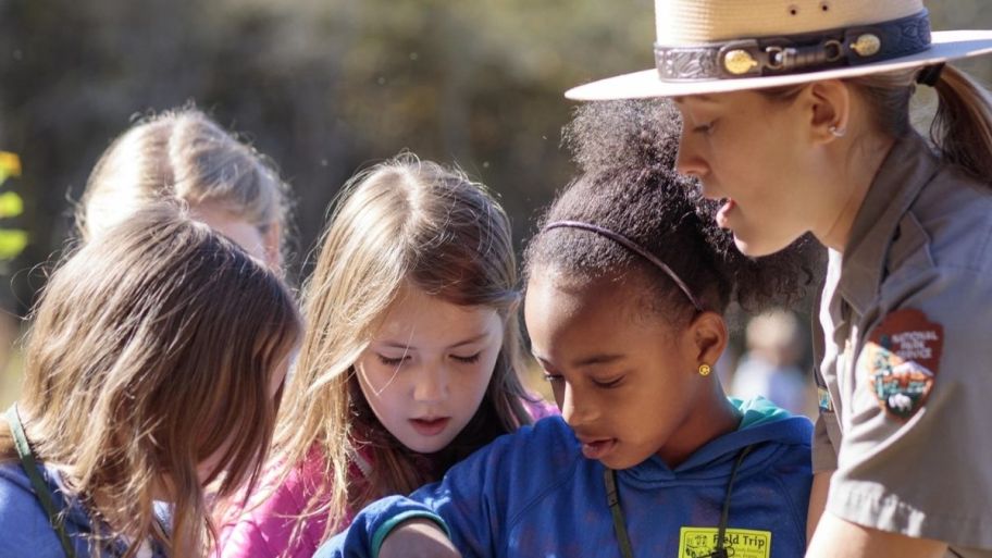 kids hanging out with park ranger
