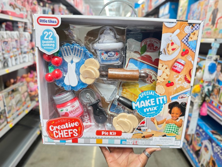 hand holding a box with a Little Tikes Creative Chefs Pie Kit playset