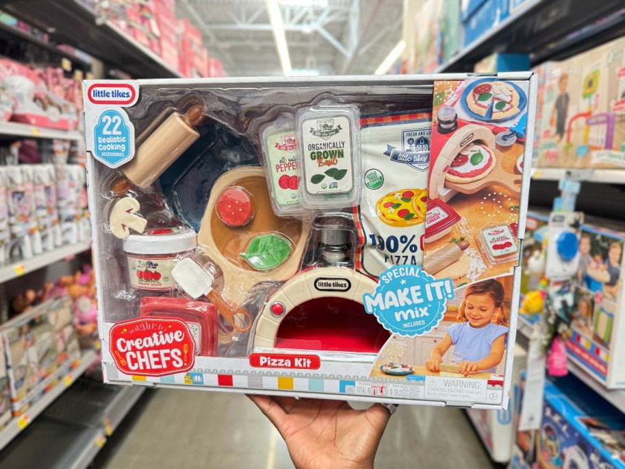 hand holding a box with a Little Tikes Creative Chefs Pizza Kit playset