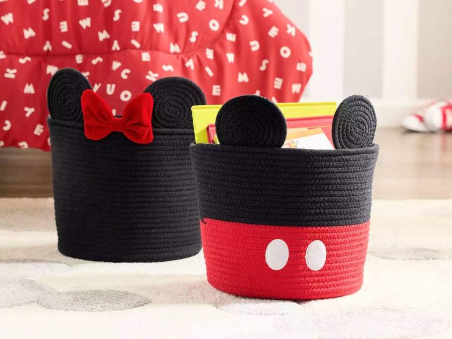 mickey and minnie mouse rope totes in front of a red onlineforter on a bed