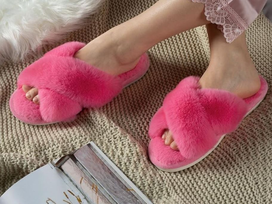 A woman's feer wearing Hot pink parlovable slippers