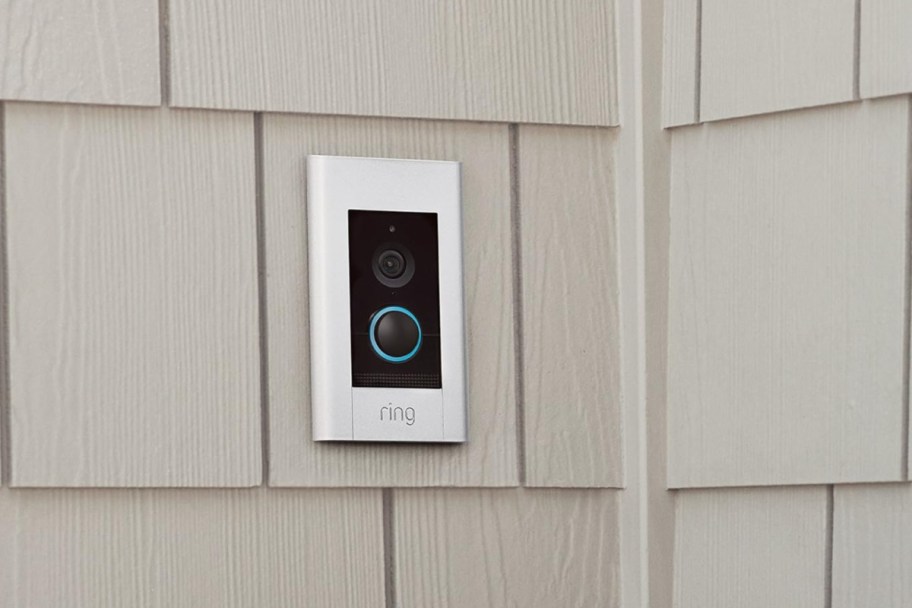 ring elite doorbell on paneled wall