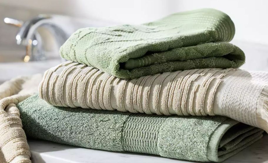 a stack of 3 sonoma textured bath towels on a bathroom counter