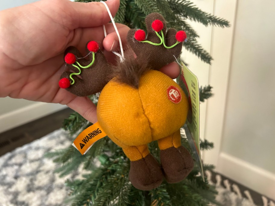 hand holding reindeer ornament