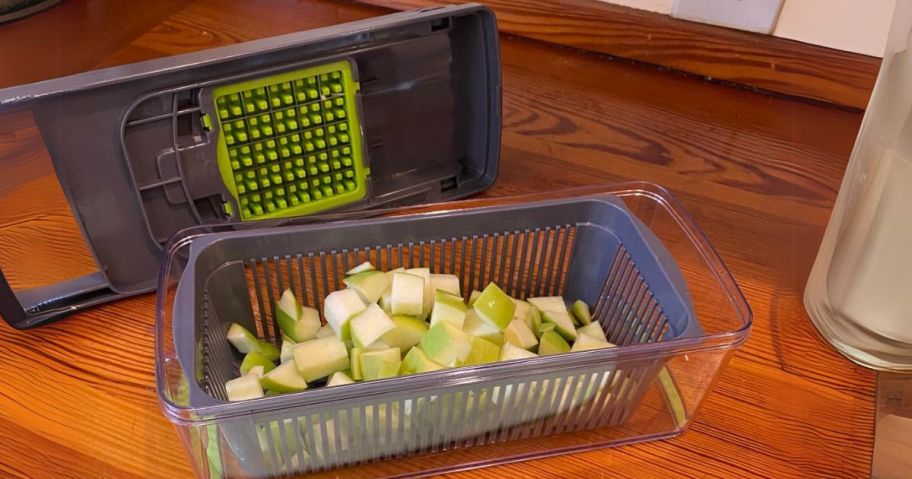 vegetable chopper on counter with apples in it