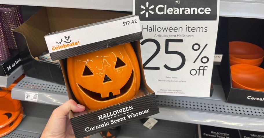 walmart clearance sign with pumpkin decoration next to it