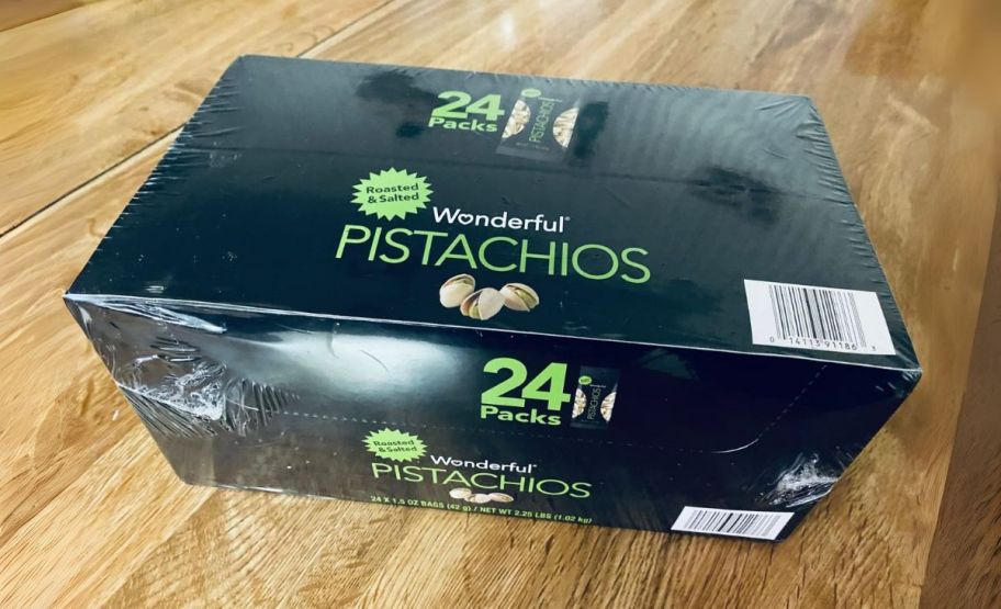 a 24 count box of pistachios on a kitchen counter