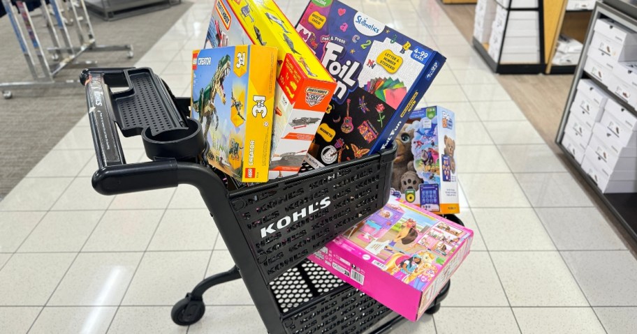 a black Kohl's shopping cart with kid's toys in it