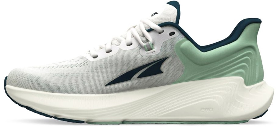 white and light green running shoe