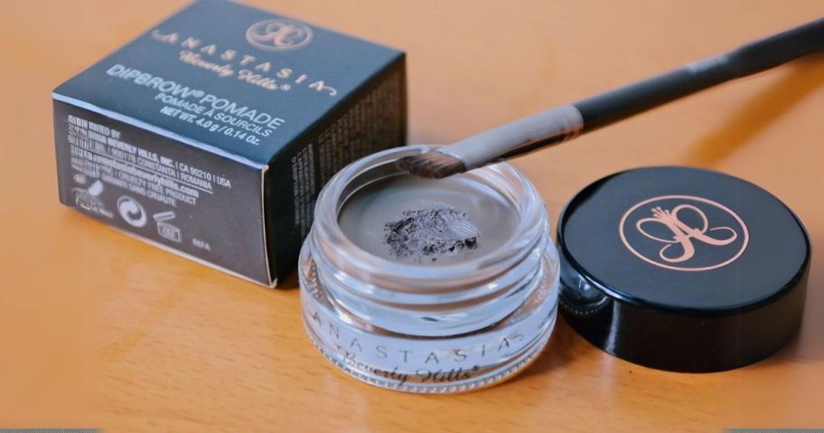 Anastasia Beverly Hills Dipbrow Pomade with brush on table