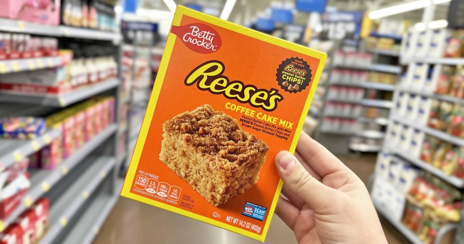 hand holding a box of Betty Crocker Reese's Coffee Cake in store