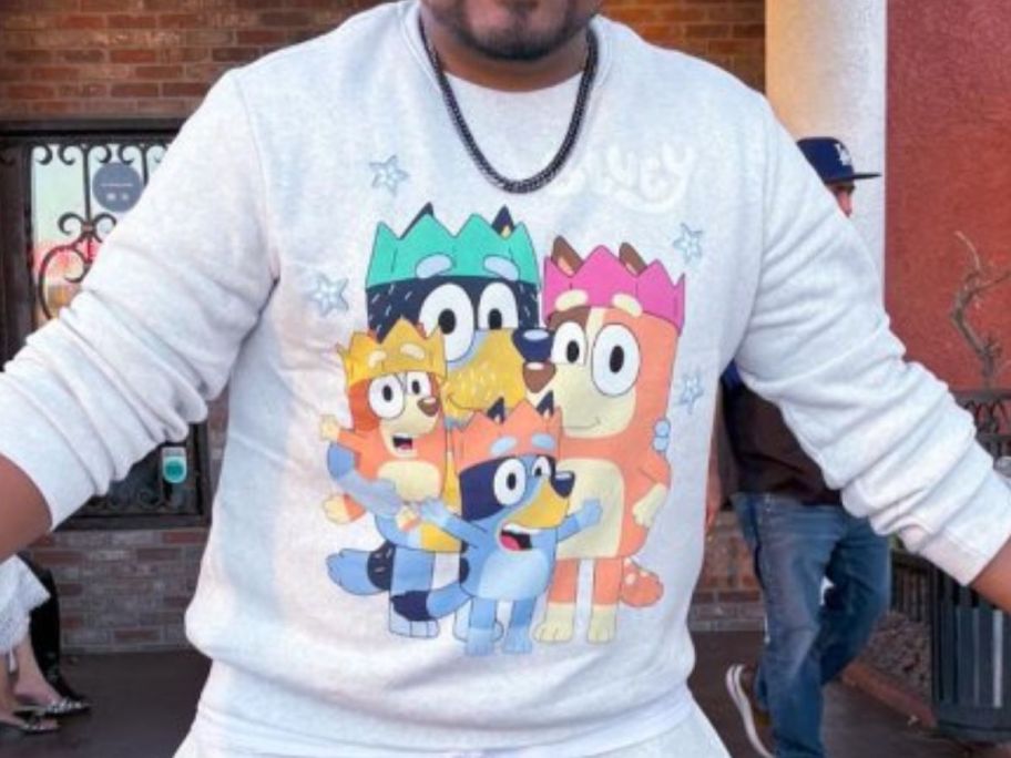 man wearing bluey sweatshirt