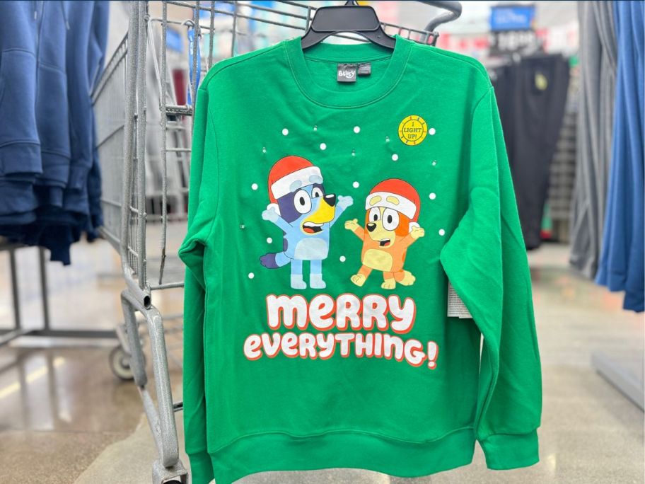 Bluey Christmas sweatshirt hanging at the store