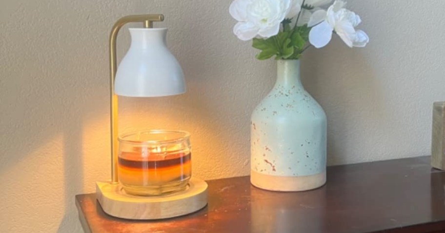 candle warmer lamp with white shade and candle on table