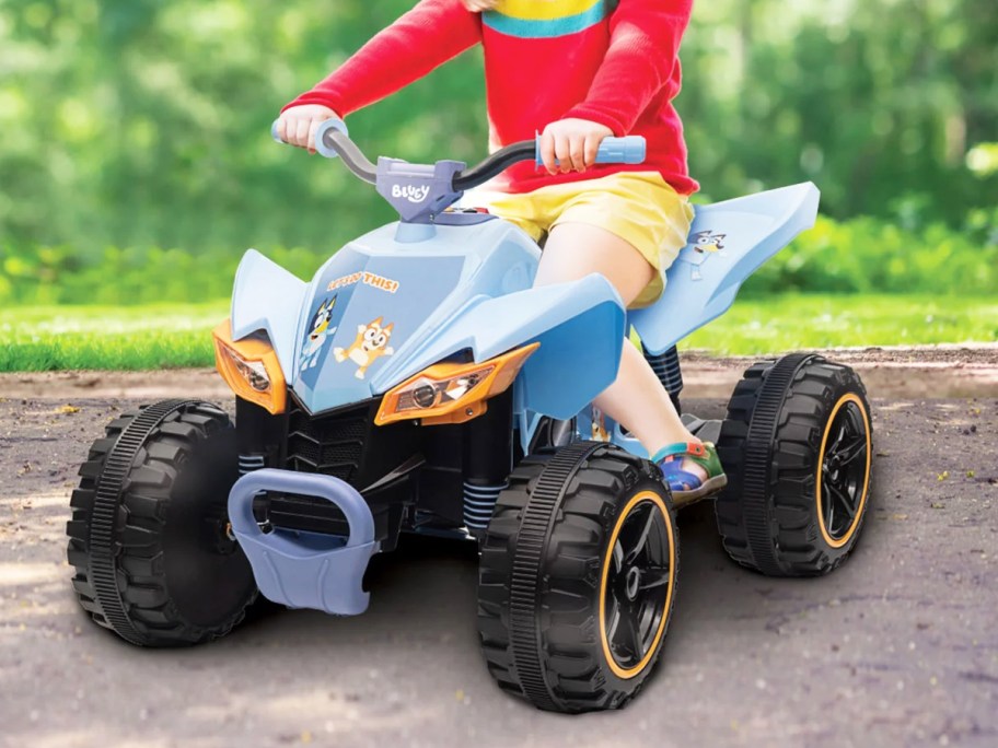 child riding on a bluey atv