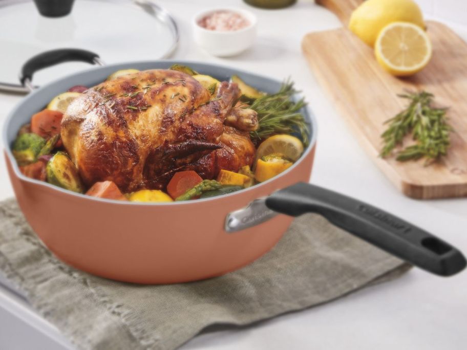 A Cuisinart Preferred Pan with a chicken and veggies inside