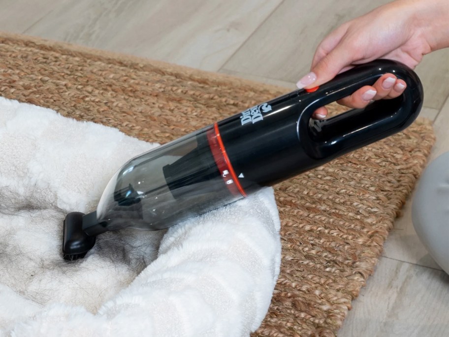 using Dirt Devil Cordless Rechargeable Handheld Vacuum to clean pet bed