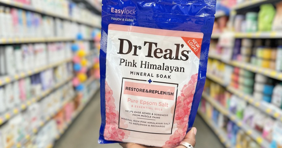 hand holding a bag of Dr Teal's Pure Epsom Salt in store