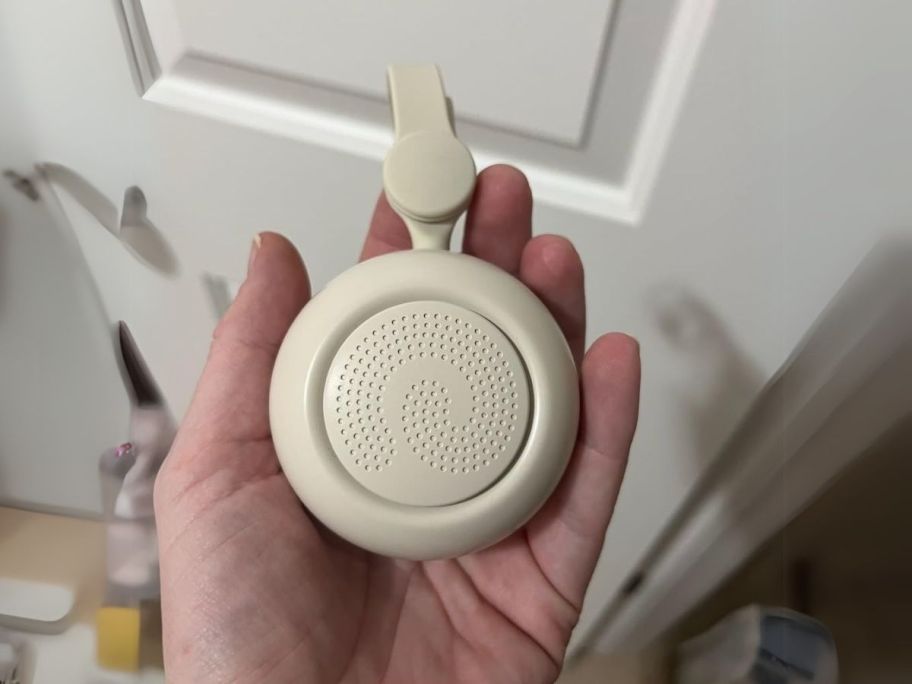 hand holding Dreamegg White Noise Machine