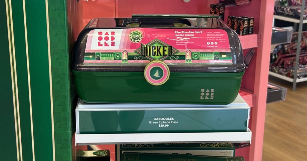 emerald colored caboodle case with wicked theme on display in ulta