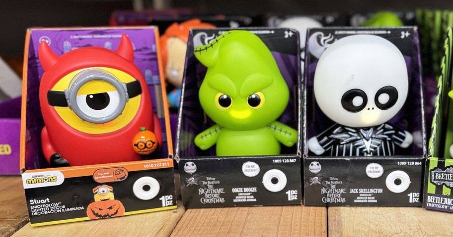 three Emoteglow character figures on store shelf