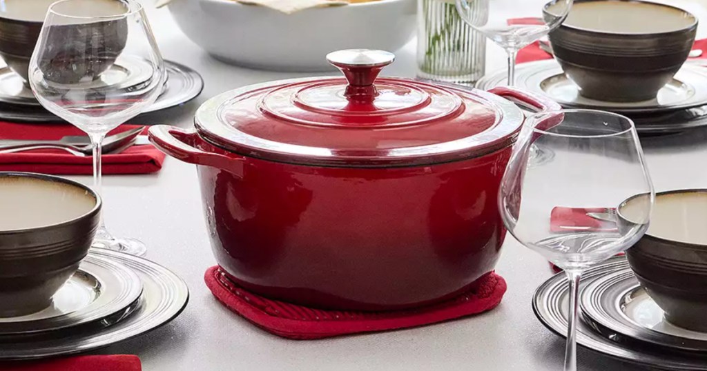 red dutch oven in center of table