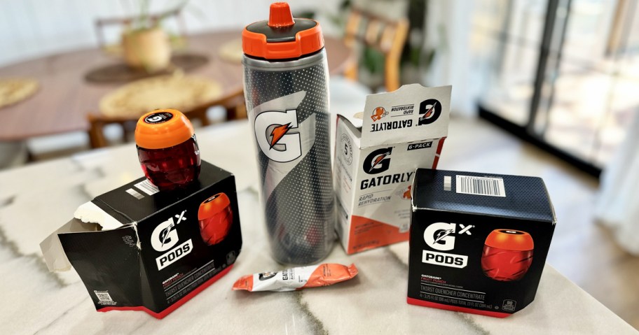 gatorade pods, hydration sticks, and water bottle on kitchen counter