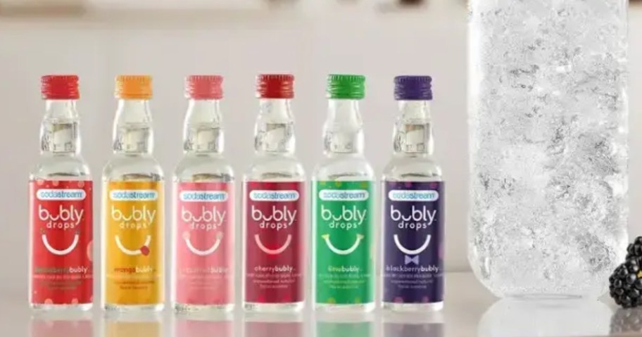 Sodastream Bubly drop bottles in a different flavors lined up a counter