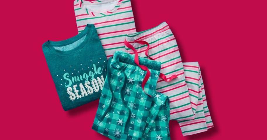 women's Christmas pajama sets with long sleeve tops and jogger style pants, green plaid set with top that says "Snuggle Season" and a white, pink, red, and green striped set on a red background