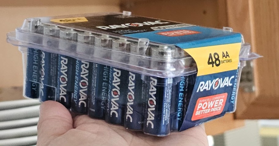 hand holding a large pack of Rayovac AA batteries