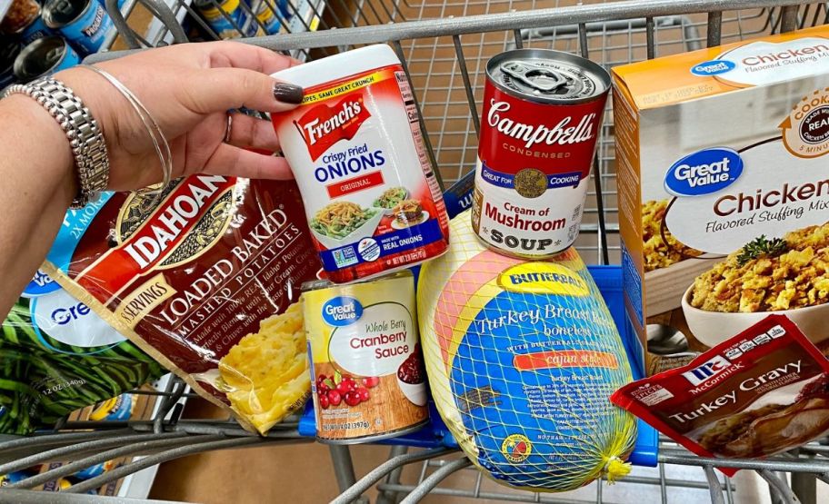 a walmart cart with groceries in it