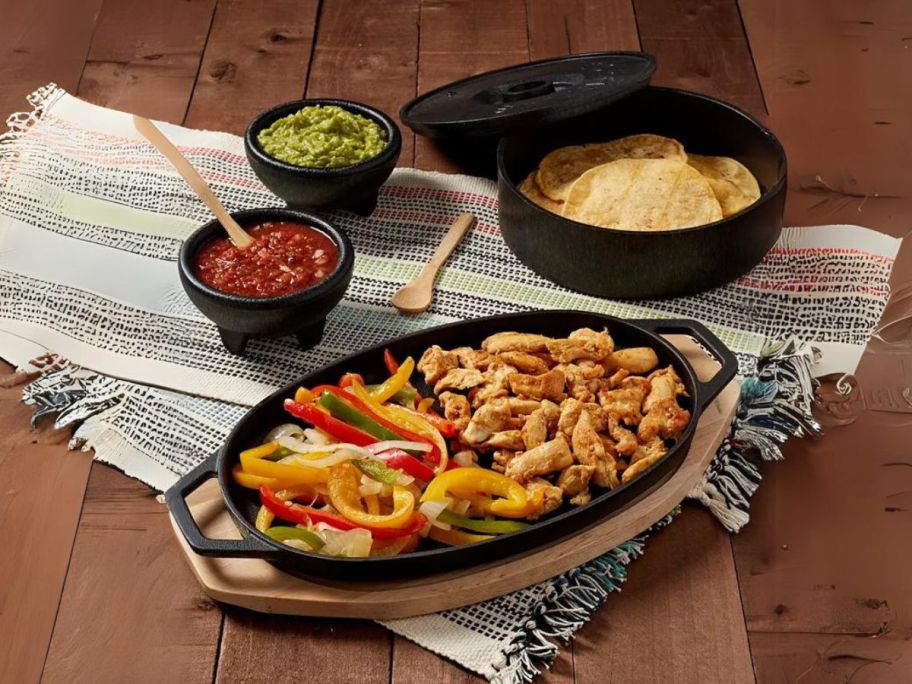 Infuse Latin Cast Iron 8-Piece Fajita Set on table