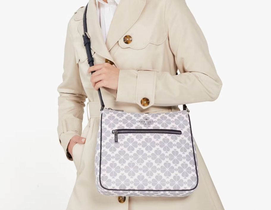 a woman with a printed crossbody bag