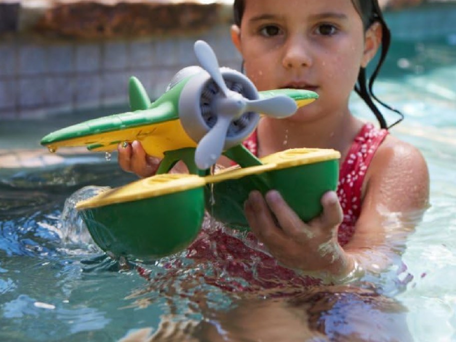 Kid playing with playing in the pool