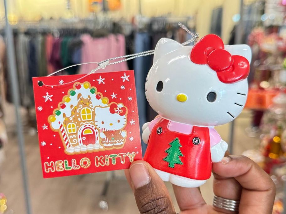 Hand holding a Kurt Adler Hello Kitty Christmas Ornament