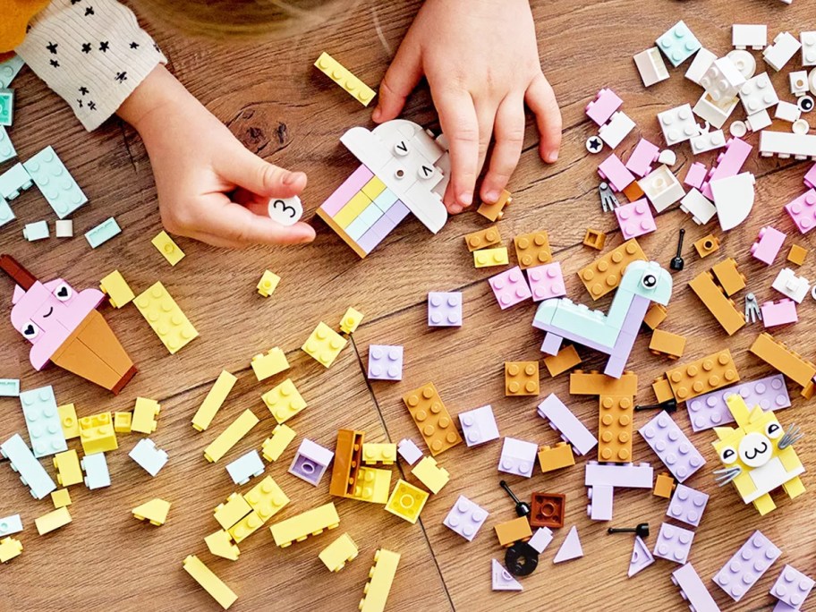 child playing with pastel legos