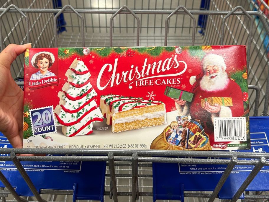 Little Debbie Christmas Tree Cakes 20-count Sam's club 20-count box in the fron of a Sam's shopping cart