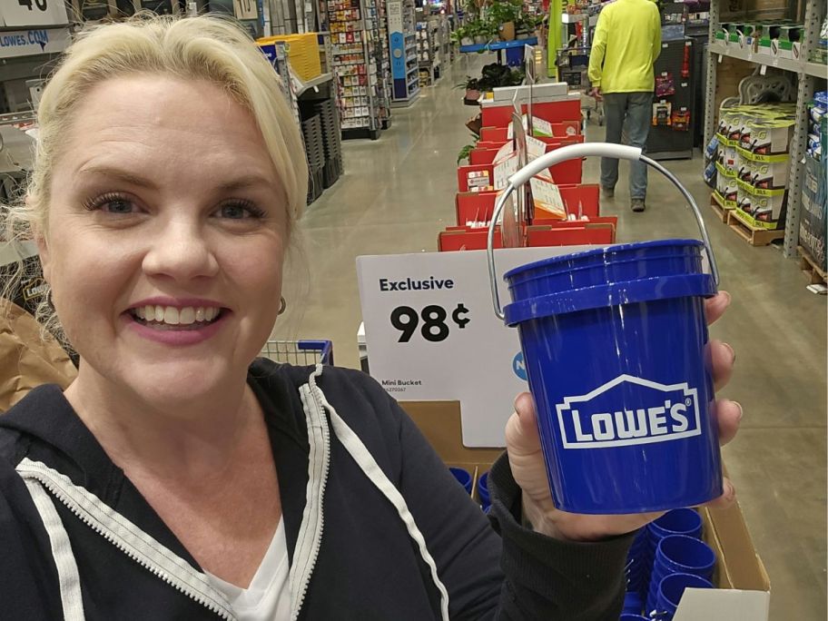 girl holding Lowe’s Mini Bucket in store