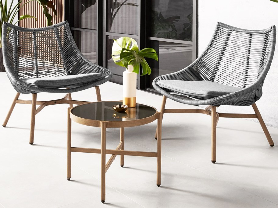 grey wicker patio chairs and coffee table