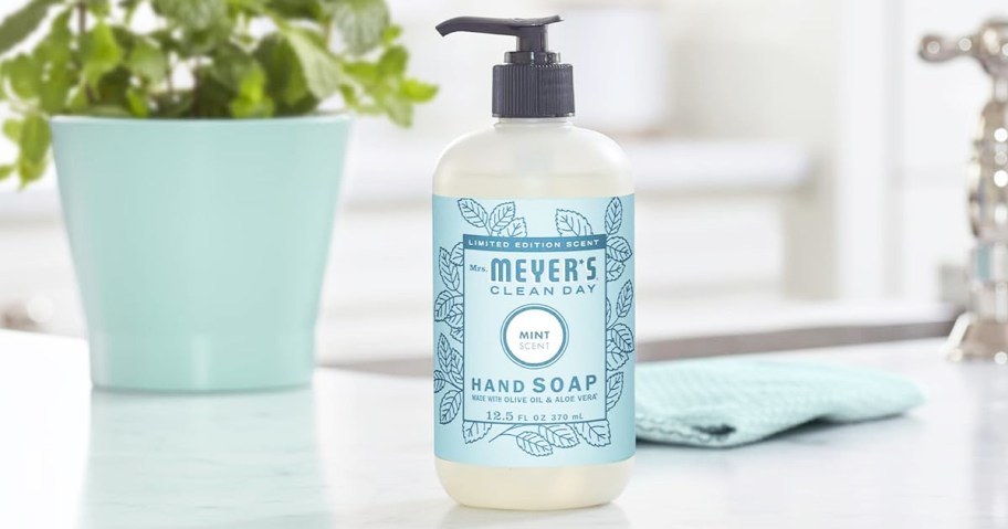 bottle of Mrs. Meyer's Liquid Hand Soap in mint scent on kitchen counter